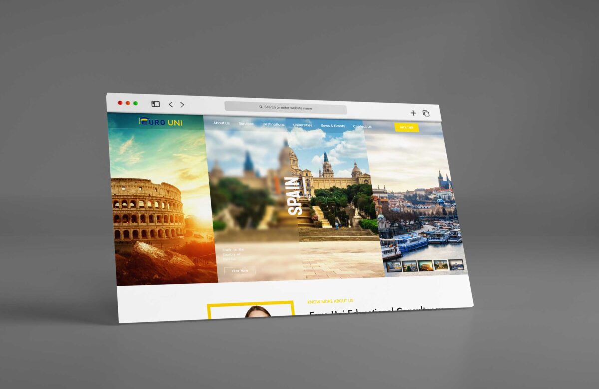 A digital mock-up of a travel website displayed on a monitor. the website features vibrant images of famous landmarks in spain, including the colosseum and cityscapes.